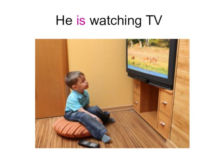 He is watching TV