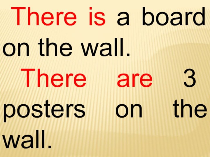 There is a board on the wall. There are 3 posters on the wall.